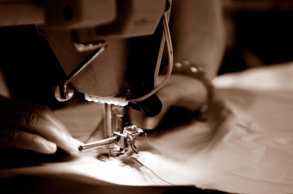 A Monte maker at the sewing bench